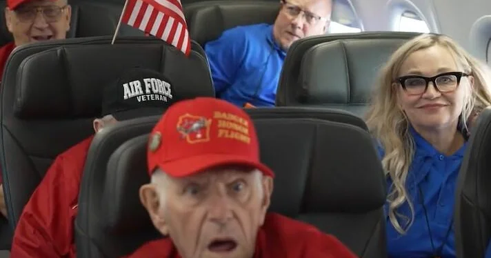 Obama surprises dozens of veterans after their plane arrives in Washington for Veterans Day